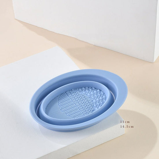 Scrubbing Plate Makeup Brush Cleaning Pad Makeup Brush Cleaning Bowl $24.00 Dana Fashion Color: Light Blue makeup Product Information Name: Makeup brush folding cleaning bowl Material: Silicone Be applicable: DIY facial mask Brewing water film Soaking bea