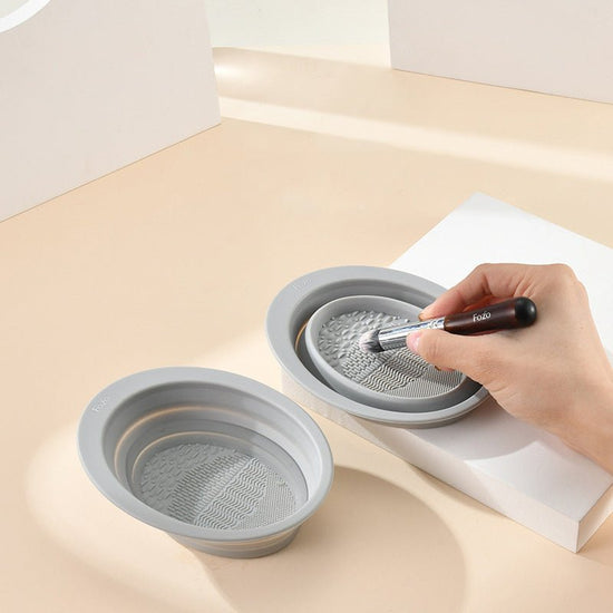 Scrubbing Plate Makeup Brush Cleaning Pad Makeup Brush Cleaning Bowl $24.00 Dana Fashion Color: Dark Purple makeup Product Information Name: Makeup brush folding cleaning bowl Material: Silicone Be applicable: DIY facial mask Brewing water film Soaking be