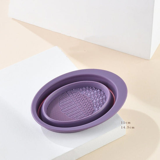 Scrubbing Plate Makeup Brush Cleaning Pad Makeup Brush Cleaning Bowl $24.00 Dana Fashion Color: Lilac Purple makeup Product Information Name: Makeup brush folding cleaning bowl Material: Silicone Be applicable: DIY facial mask Brewing water film Soaking b