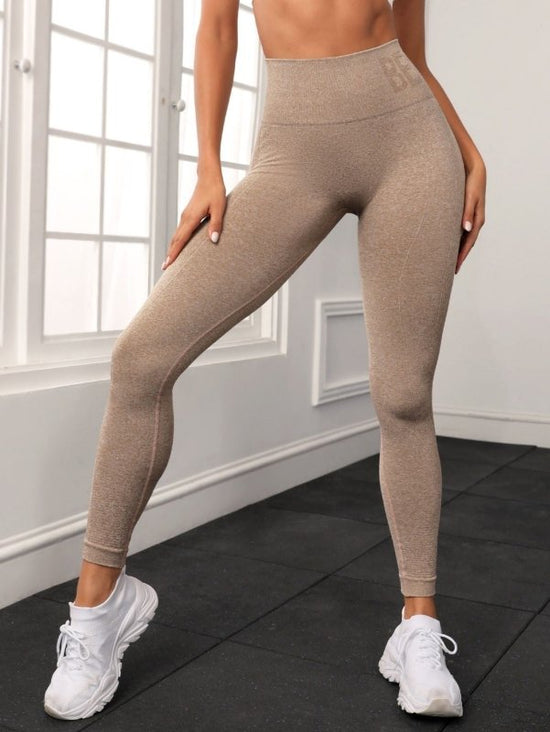 Seamless Letter Peach Yoga Hip Raise Skinny High Waist Exercise Workout Pants Women $46.96 Dana Fashion Color: Khaki Size: L Women's clothing Product information: Applicable sports: fitness yoga Fabric name: Chemical Fiber blend Applicable scenarios: runn