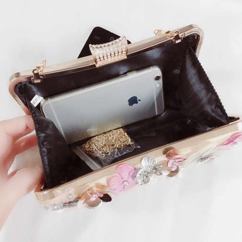 Sequined Flower Diamond Banquet Bag $84.35 Dana Fashion Color: Champagne Women's Bags Material: Silk Fabric texture: polyester fiber Lining texture: polyester Style: women's clutch Bag shape: pillow type Trendy Bags Style: Dinner Bag Opening method: ingot