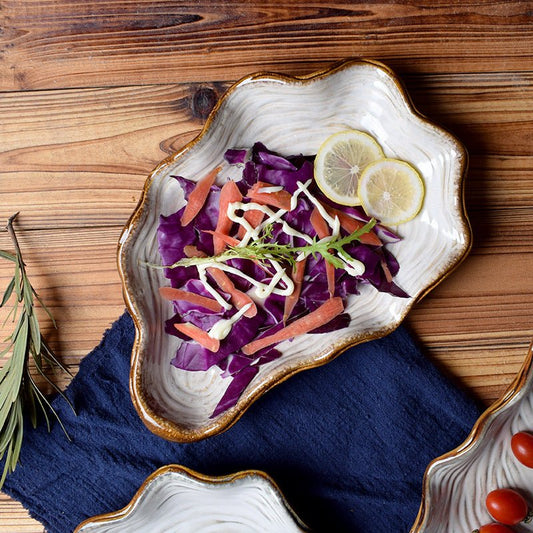 Shaped plate shell plate $38.32 Dana Fashion Color: Dark blue Dana's Kitchen Material: Porcelain Applicable people: adults pattern: plain Style: Japan and South Korea Shape: irregular Microwave oven: available Applicable scene: Hotel, meals, restaurants,