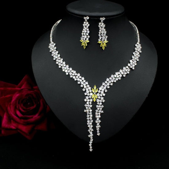 Silver Needle Fashion Exaggerated Inlaid Zircon Earrings And Necklace Set $272.74 Dana Fashion Color: Blue Women's Accessories Product information: Treatment Process: inlaid zircon Color: red, yellow, green, blue, white Pendant material: mixed gem inlaid