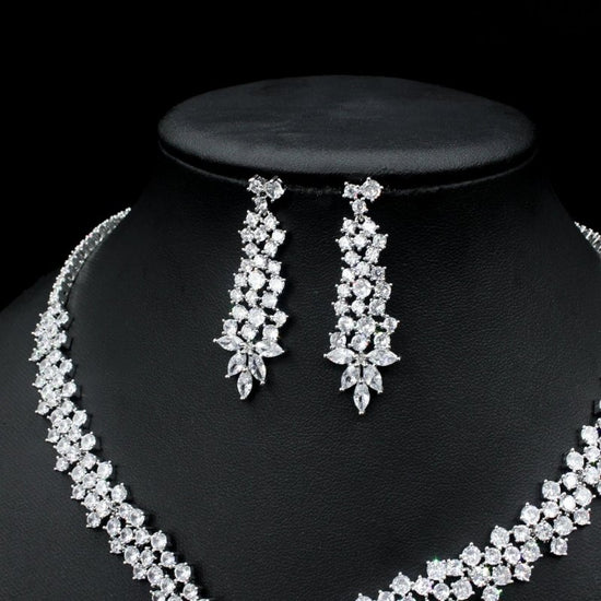 Silver Needle Fashion Exaggerated Inlaid Zircon Earrings And Necklace Set $272.74 Dana Fashion Color: White Women's Accessories Product information: Treatment Process: inlaid zircon Color: red, yellow, green, blue, white Pendant material: mixed gem inlaid
