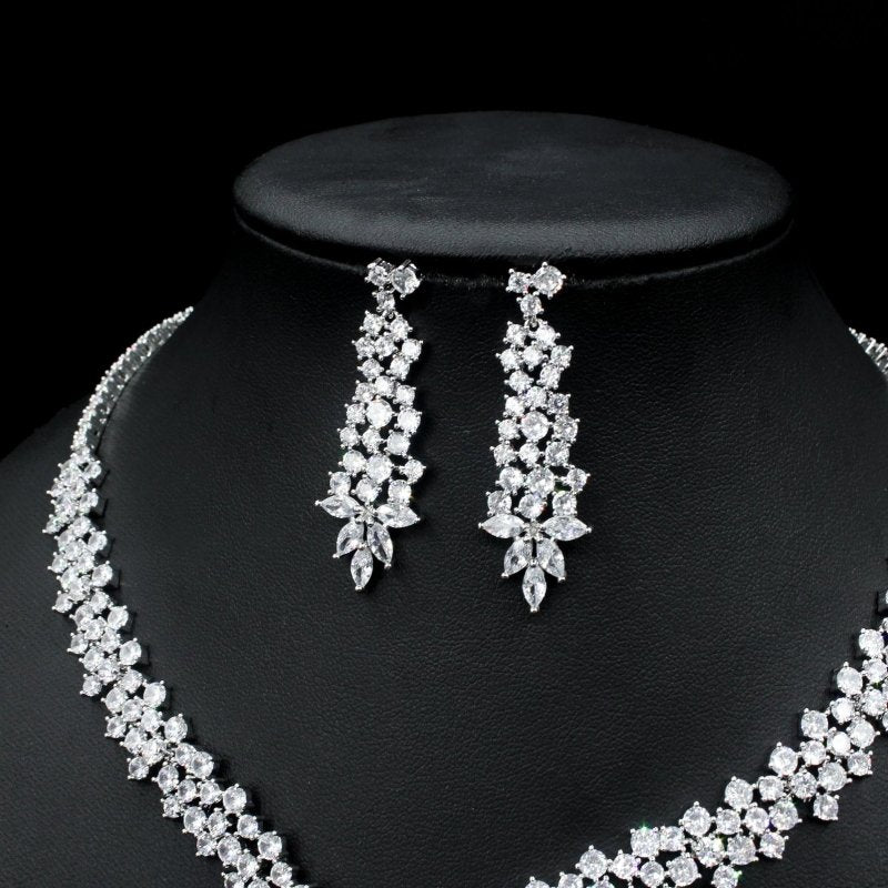 Silver Needle Fashion Exaggerated Inlaid Zircon Earrings And Necklace Set $272.74 Dana Fashion Color: White Women's Accessories Product information: Treatment Process: inlaid zircon Color: red, yellow, green, blue, white Pendant material: mixed gem inlaid