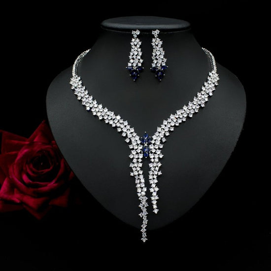 Silver Needle Fashion Exaggerated Inlaid Zircon Earrings And Necklace Set $272.74 Dana Fashion Color: Blue Women's Accessories Product information: Treatment Process: inlaid zircon Color: red, yellow, green, blue, white Pendant material: mixed gem inlaid