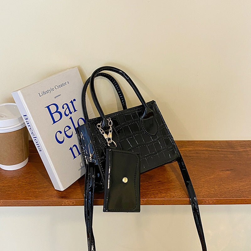 Simple Texture Shoulder Messenger Bag $29.29 Dana Fashion Color: Black Women's Bags Product information: Color: black, orange, green, pink, silver Material: PU Suitcase shape: Horizontal Square Packing list: Bag*1 Product Image: