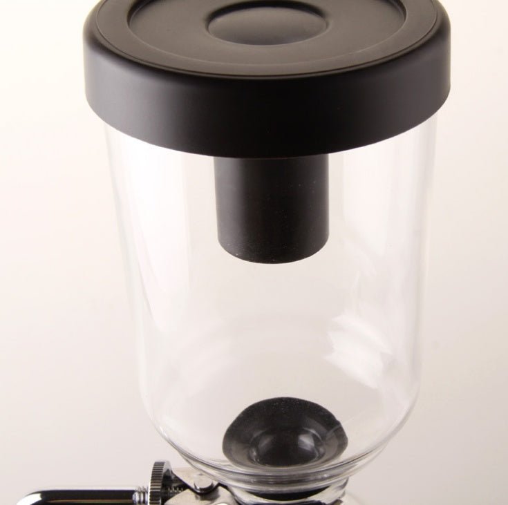 Siphon Coffee Maker Tea Pot Vacuum Coffeemaker Glass Machine $128.46 Dana Fashion Color: Black Dana's Kitchen Specifications: [Capacity] 3 persons (TCA-3) [Specification] 36*16*14CM [net weight] 1300 grams [Accessories] bracket + upper limb + lower limb +