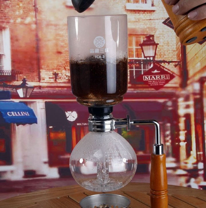 Siphon Coffee Maker Tea Pot Vacuum Coffeemaker Glass Machine $128.46 Dana Fashion Color: Black Dana's Kitchen Specifications: [Capacity] 3 persons (TCA-3) [Specification] 36*16*14CM [net weight] 1300 grams [Accessories] bracket + upper limb + lower limb +