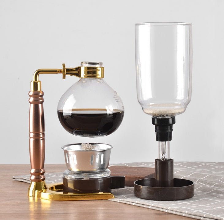 Siphon Coffee Maker Tea Pot Vacuum Coffeemaker Glass Machine $128.46 Dana Fashion Color: Black Dana's Kitchen Specifications: [Capacity] 3 persons (TCA-3) [Specification] 36*16*14CM [net weight] 1300 grams [Accessories] bracket + upper limb + lower limb +