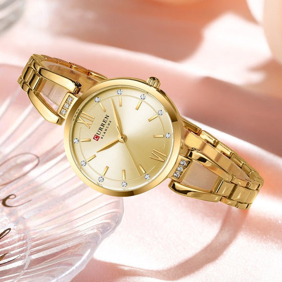 Small Dial Waterproof Simple Women's Quartz Wrist Watch $39.00 Dana Fashion Color: Gold Strap Gold Noodles Women's Accessories Product information: Color: gold watchband gold shell green surface, gold watchband gold shell gold surface, gold watchband gold