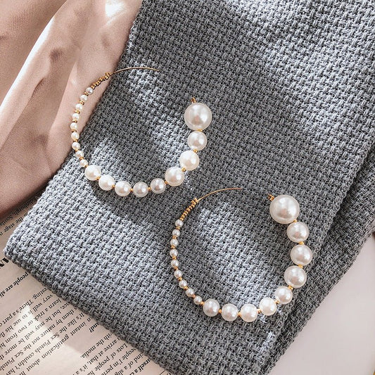 South Korea Dongdaemun Fashion Pearl C- Shaped Earrings $15.00 Dana Fashion Color: White Women's Accessories Product information: Process: Electroplating Color: White Material: Alloy Shape: Geometry Packing list: Earrings*1pairs Product Image: