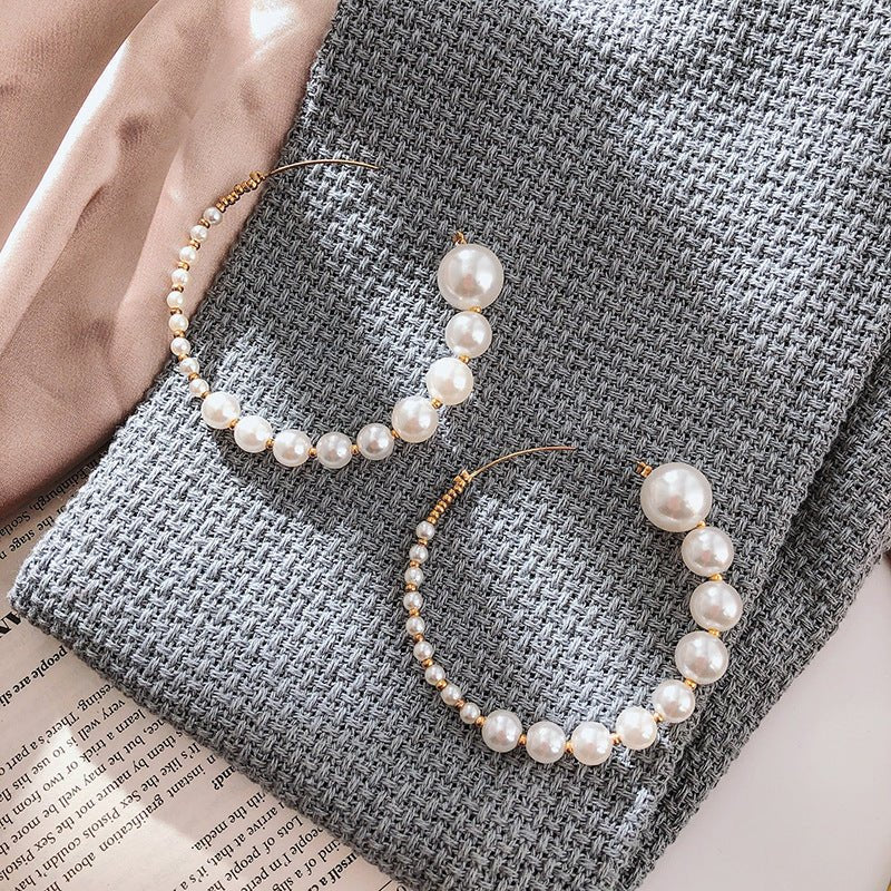 South Korea Dongdaemun Fashion Pearl C- Shaped Earrings $15.00 Dana Fashion Color: White Women's Accessories Product information: Process: Electroplating Color: White Material: Alloy Shape: Geometry Packing list: Earrings*1pairs Product Image:
