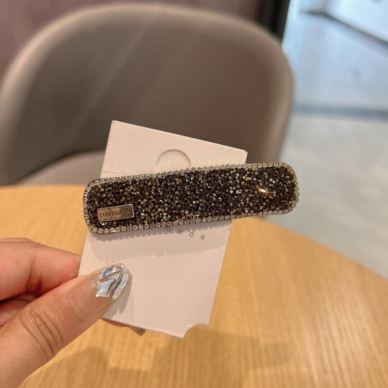 Stylish Graceful Simple Versatile High Sense Barrettes New $10.00 Dana Fashion Color: Gold Women's Accessories Product information: Processing process: manual Color: black, gold, champagne, silver, apricot, pink Applicable people: women Material: artifici