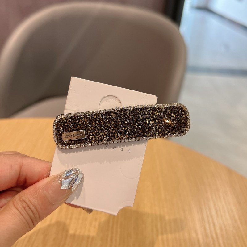 Stylish Graceful Simple Versatile High Sense Barrettes New $10.00 Dana Fashion Color: Gold Women's Accessories Product information: Processing process: manual Color: black, gold, champagne, silver, apricot, pink Applicable people: women Material: artifici