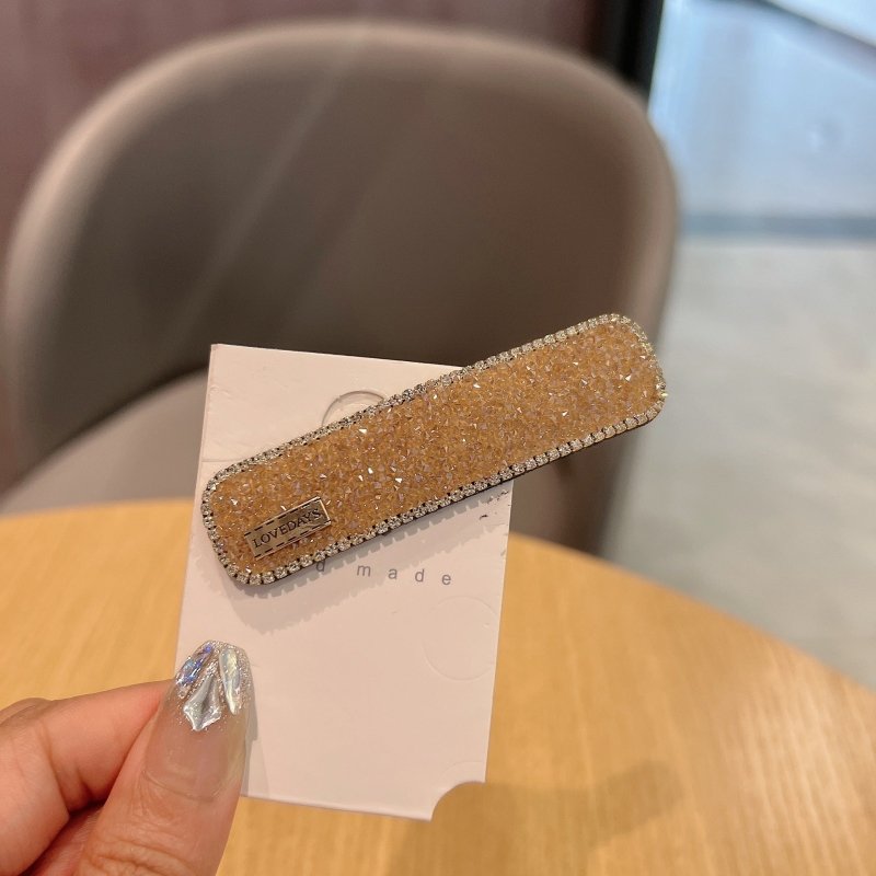 Stylish Graceful Simple Versatile High Sense Barrettes New $10.00 Dana Fashion Color: Champagne Women's Accessories Product information: Processing process: manual Color: black, gold, champagne, silver, apricot, pink Applicable people: women Material: art