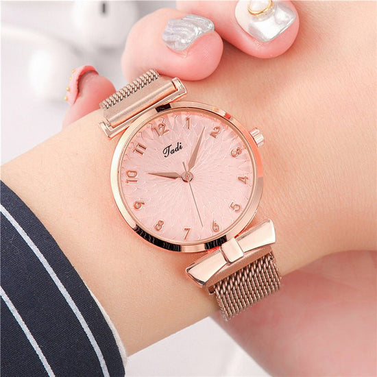 Suit Women's Quartz Watch With Bracelet $15.00 Dana Fashion Color: Rose Pink Gold Bracelet Women's Accessories Product information: Color: Rose pink gold bracelet Thickness: 8mm Dial diameter: 26mm Crown type: Spiral crown Mirror material: mineral reinfor