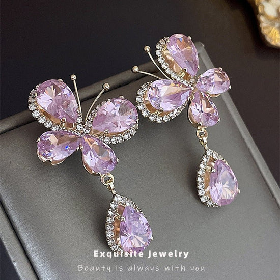 Sweet Light Luxury Rhinestone Zircon Butterfly Water Drop Silver Pin Earrings $14.50 Dana Fashion Color: Silver Needle Pink Women's Accessories Product information: Treatment Process: Diamond Color: Silver Needle pink butterfly water drop earrings Applica