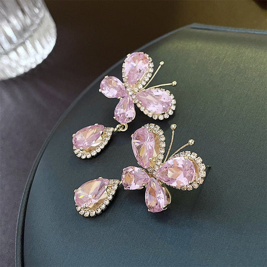 Sweet Light Luxury Rhinestone Zircon Butterfly Water Drop Silver Pin Earrings $14.50 Dana Fashion Color: Silver Needle Pink Women's Accessories Product information: Treatment Process: Diamond Color: Silver Needle pink butterfly water drop earrings Applica