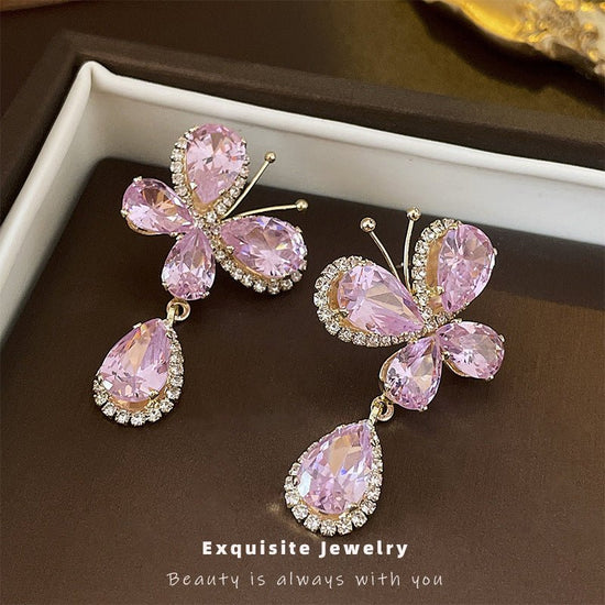 Sweet Light Luxury Rhinestone Zircon Butterfly Water Drop Silver Pin Earrings $14.50 Dana Fashion Color: Silver Needle Pink Women's Accessories Product information: Treatment Process: Diamond Color: Silver Needle pink butterfly water drop earrings Applica