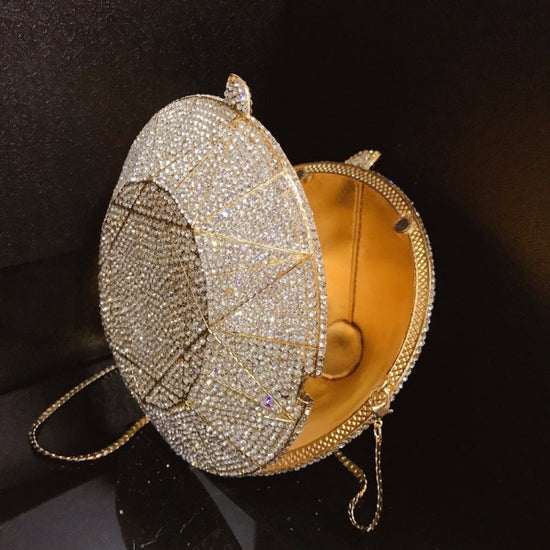 Three-dimensional diamond shape handbags $159.00 Dana Fashion Color: Gold Women's Bags Three dimensional diamond crystal Dinner Bag Gemstone cutting surface, geometric line is clear Each crystal diamond is inlaid by hand, which is fashionable and bright E