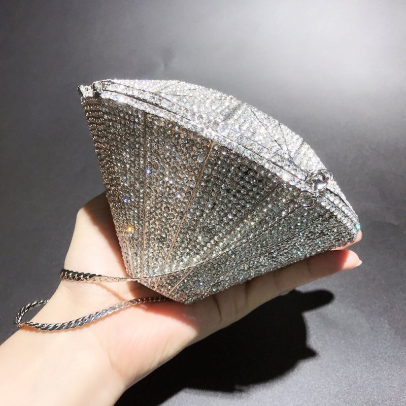 Three-dimensional diamond shape handbags $159.00 Dana Fashion Color: Silver Women's Bags Three dimensional diamond crystal Dinner Bag Gemstone cutting surface, geometric line is clear Each crystal diamond is inlaid by hand, which is fashionable and bright