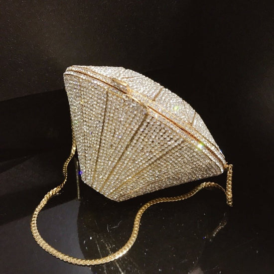Three-dimensional diamond shape handbags $159.00 Dana Fashion Color: Gold Women's Bags Three dimensional diamond crystal Dinner Bag Gemstone cutting surface, geometric line is clear Each crystal diamond is inlaid by hand, which is fashionable and bright E