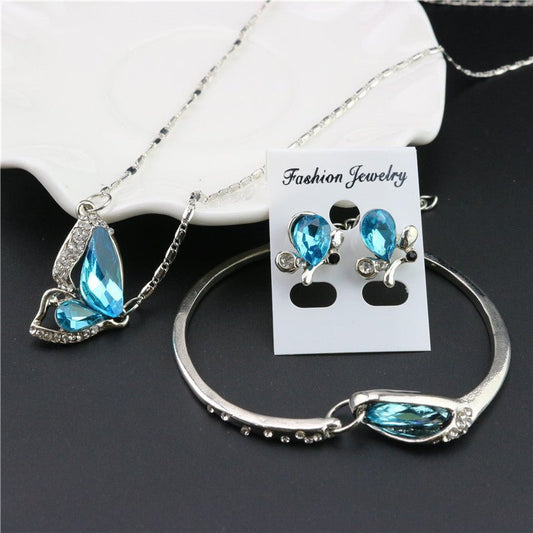 Three-piece necklace set $27.00 Dana Fashion Color: Blue Women's Accessories Style: Europe and America Material: Alloy Treatment process: diamond Style; women's style Set combination: earrings + accessories + jewelry Pendant material: alloy Pattern ;/spid