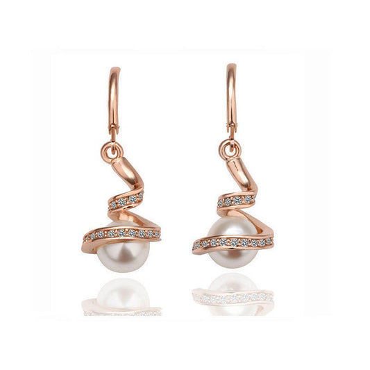 Twisted snake pearl $19.99 Dana Fashion Style: Earrings Color: Glod white Women's Accessories Material: Alloy