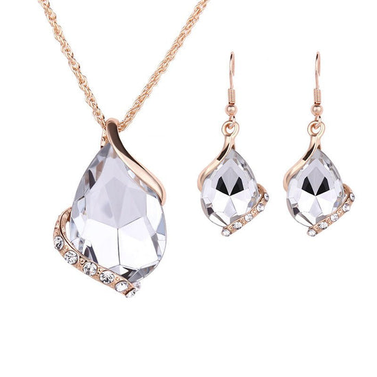 Water Drop Necklace Earring Set $25.00 Dana Fashion Color: White Women's Accessories Style: European and American Material: Alloy Processing technology: Diamond Style: Women's Set combination: Earrings + item decorations Inlay material: White gold/K white