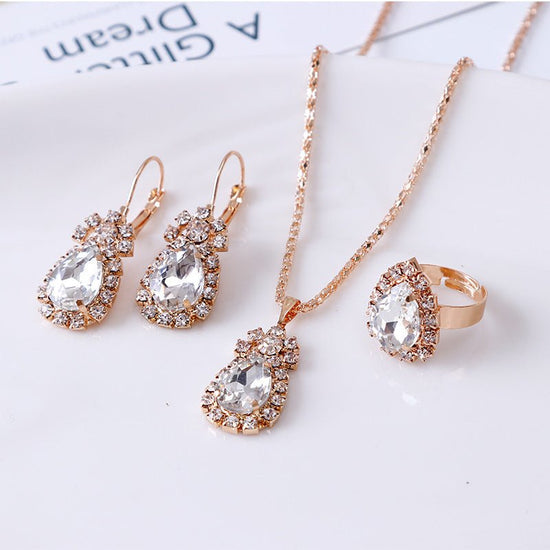 Water drop rhinestone necklace earrings ring set $22.99 Dana Fashion Color: White Women's Accessories Style: Europe and America Material: Alloy Processing technology: diamond Style: Women's Circumference: 43CM+extended chain 5CM
