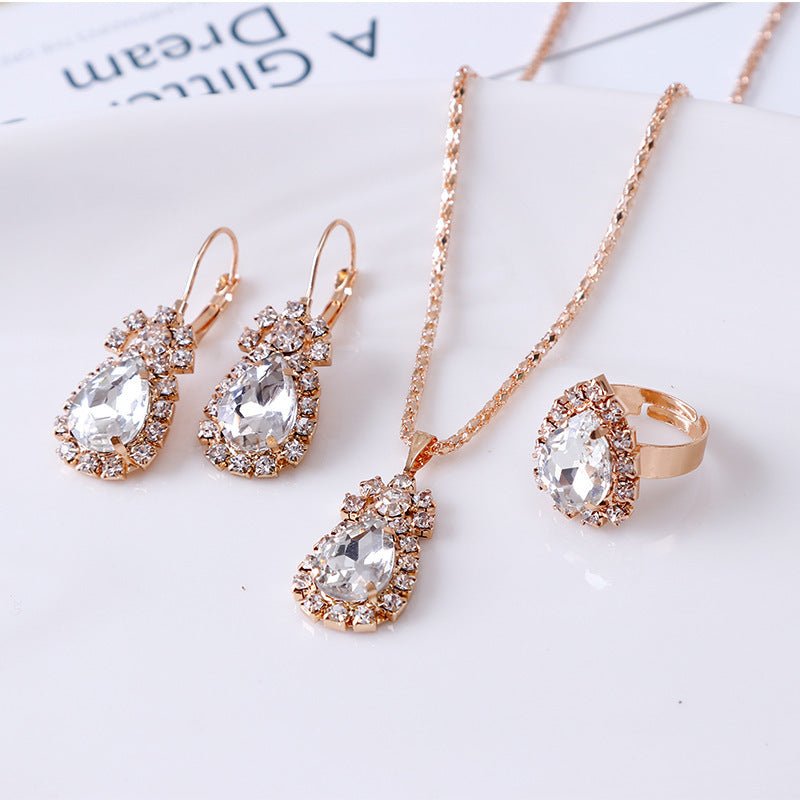 Water drop rhinestone necklace earrings ring set $22.99 Dana Fashion Color: White Women's Accessories Style: Europe and America Material: Alloy Processing technology: diamond Style: Women's Circumference: 43CM+extended chain 5CM