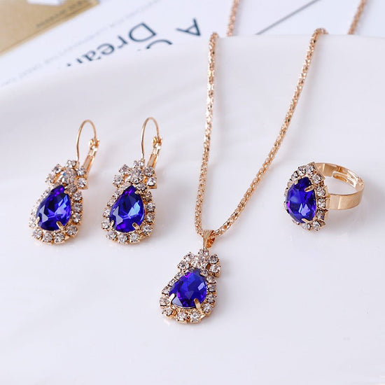 Water drop rhinestone necklace earrings ring set $22.99 Dana Fashion Color: Royal blue Women's Accessories Style: Europe and America Material: Alloy Processing technology: diamond Style: Women's Circumference: 43CM+extended chain 5CM