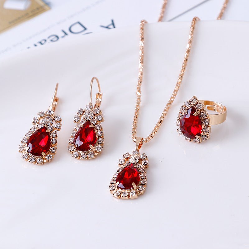 Water drop rhinestone necklace earrings ring set $22.99 Dana Fashion Color: Red Women's Accessories Style: Europe and America Material: Alloy Processing technology: diamond Style: Women's Circumference: 43CM+extended chain 5CM