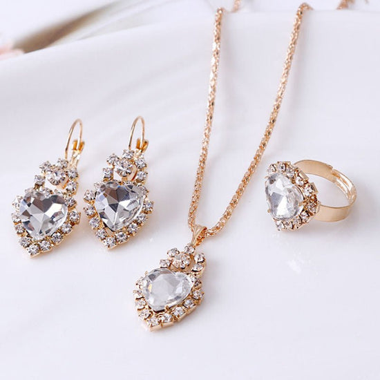 Water drop rhinestone necklace earrings ring set $22.99 Dana Fashion Color: Heart white Women's Accessories Style: Europe and America Material: Alloy Processing technology: diamond Style: Women's Circumference: 43CM+extended chain 5CM