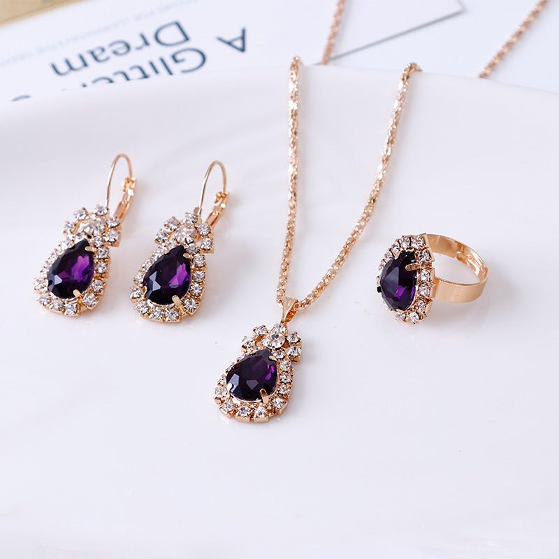 Water drop rhinestone necklace earrings ring set $22.99 Dana Fashion Color: Dark purple Women's Accessories Style: Europe and America Material: Alloy Processing technology: diamond Style: Women's Circumference: 43CM+extended chain 5CM