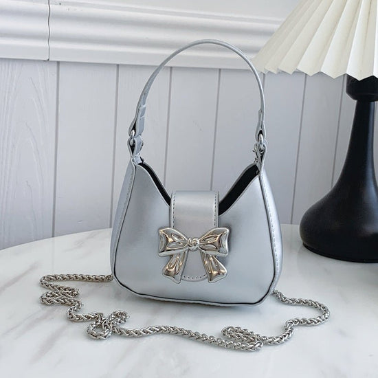 Western Style Niche Messenger Fashion Shoulder Underarm New Moon Bag $20.90 Dana Fashion Color: Silver Women's Bags Product information: Lining texture: synthetic leather Applicable scenario: Daily matching Color: black, silver, red, beige Outer bag type: