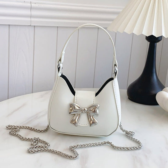 Western Style Niche Messenger Fashion Shoulder Underarm New Moon Bag $20.90 Dana Fashion Color: Beige Women's Bags Product information: Lining texture: synthetic leather Applicable scenario: Daily matching Color: black, silver, red, beige Outer bag type: