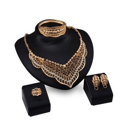 Wild style alloy necklace earrings $29.00 Dana Fashion Color: Gold Women's Accessories Style: Europe and America Material: Alloy Processing technology: diamond Style: Women's Set combination: earrings + item decoration + hand decoration Mosaic material: a