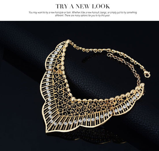 Wild style alloy necklace earrings $29.00 Dana Fashion Color: Gold Women's Accessories Style: Europe and America Material: Alloy Processing technology: diamond Style: Women's Set combination: earrings + item decoration + hand decoration Mosaic material: a
