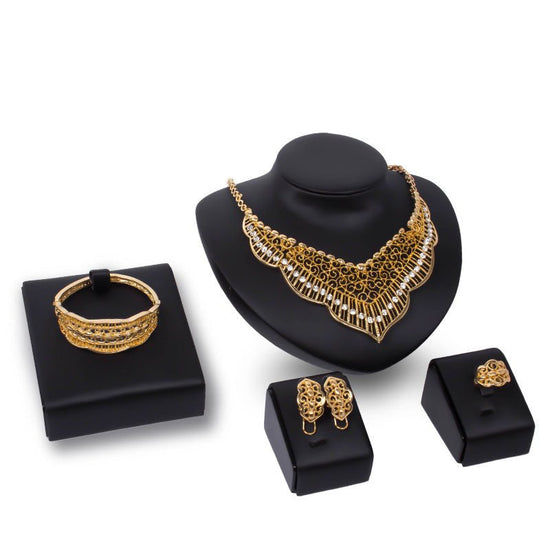 Wild style alloy necklace earrings $29.00 Dana Fashion Color: Gold Women's Accessories Style: Europe and America Material: Alloy Processing technology: diamond Style: Women's Set combination: earrings + item decoration + hand decoration Mosaic material: a