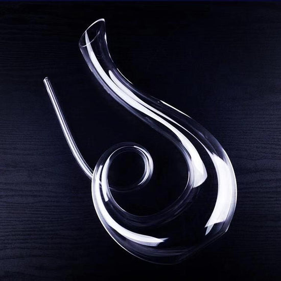 Wine Decanter Hip Flask Pourer Family Bar $78.77 Dana Fashion Color: Winkle shaped Dana's Kitchen Overview: High-end Large capacity red wine glasses decanter. Lead-free crystal glass material, health, safety. Cold incision process, fine workmanship. Speci