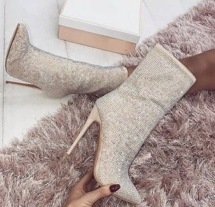 Women Pointed Toe Heeled Boots $69.50 Dana Fashion Color: Beige Size: 35 Women's shoes Upper material; suede Sole material; plastic Applicable gender; female Style; Europe and America Toe shape; pointed toe Heel shape; stiletto Heel height; super high hee