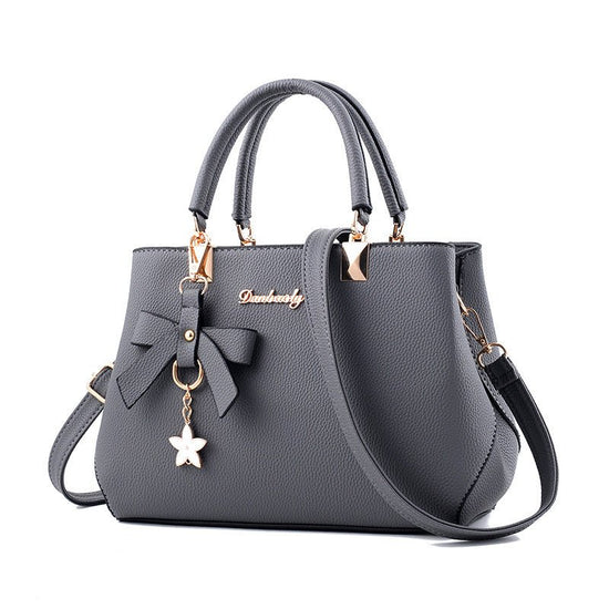 Women Shoulder Bag With Bowknot Star Pendant Totes $47.00 Dana Fashion Color: Light gray Women's Bags Product information: Color: wine red, light gray, green, dark blue, black, oak pink, brown Style: urban simplicity Material: PU Luggage Trend Style: Kill