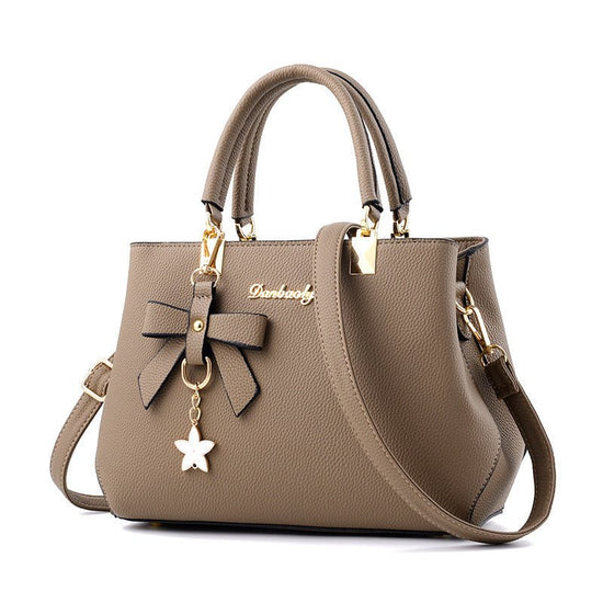 Women Shoulder Bag With Bowknot Star Pendant Totes $47.00 Dana Fashion Color: Brown Women's Bags Product information: Color: wine red, light gray, green, dark blue, black, oak pink, brown Style: urban simplicity Material: PU Luggage Trend Style: Killer Ba