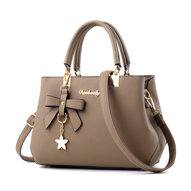 Women Shoulder Bag With Bowknot Star Pendant Totes $47.00 Dana Fashion Color: Brown Women's Bags Product information: Color: wine red, light gray, green, dark blue, black, oak pink, brown Style: urban simplicity Material: PU Luggage Trend Style: Killer Ba