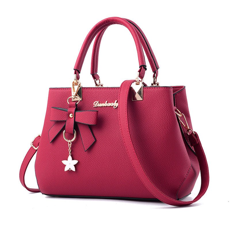 Women Shoulder Bag With Bowknot Star Pendant Totes $47.00 Dana Fashion Color: Wine red Women's Bags Product information: Color: wine red, light gray, green, dark blue, black, oak pink, brown Style: urban simplicity Material: PU Luggage Trend Style: Killer