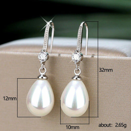 Women's Elegant Drop-shaped Imitation Pearl Long Earrings $8.36 Dana Fashion Color: E1604 White Gold Color Women's Accessories Product information: Treatment Process: pearl inlaid Color: E1604 white gold color Material: Copper Shape: Geometric Packing lis