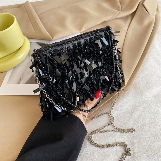 Women's Fashion Retro Sequin Tassel Handbag $63.39 Dana Fashion Color: Black Women's Bags Product information: Color: white, black, gold, silver, pink Material: acrylic plastic Popular elements: sequins Lining texture: polyester Bag shape: horizontal squa
