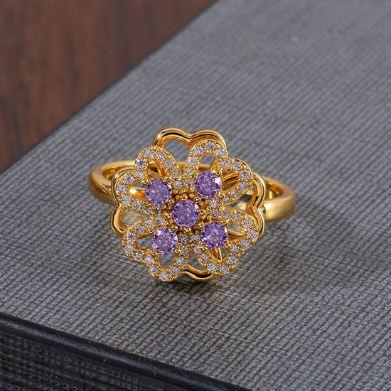 Women's Fashion Rotatable Purple Diamond Ring $15.50 Dana Fashion Color: J1560Purple Women's Accessories Product information: Type: Ring Color: J1560-Purple Applicable population: Female Material: Copper Shape: Flower Style: Natural Packing list: Ring *1